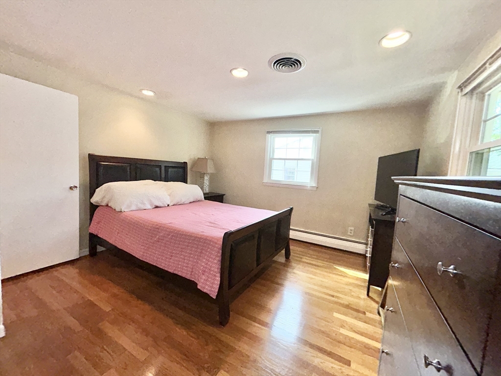 98 Sheffield Road Cranston, RI 02920 - Photo 10 of 23 a bedroom with a bed and window