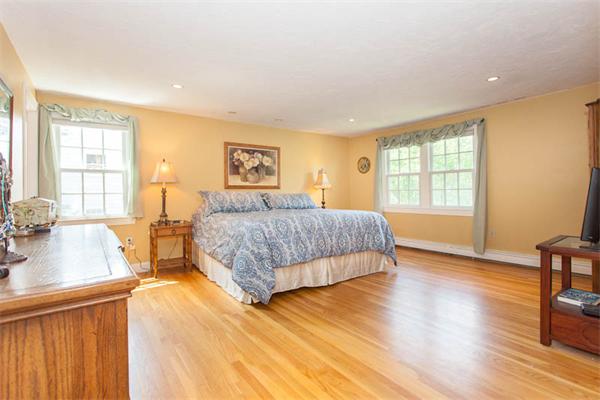 39 Circle Road Lexington, MA 02420 - Photo 13 of 24 a bedroom with a large bed and a dresser