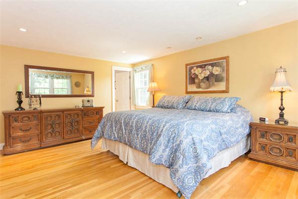 39 Circle Road Lexington, MA 02420 - Photo 14 of 24 a spacious bedroom with a bed a dresser and next to a window