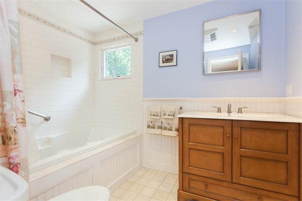 39 Circle Road Lexington, MA 02420 - Photo 15 of 24 a bathroom with a bathtub sink and toilet