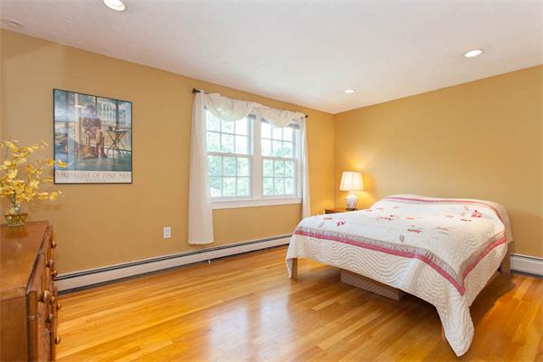 39 Circle Road Lexington, MA 02420 - Photo 17 of 24 a bedroom with a bed and wooden floor