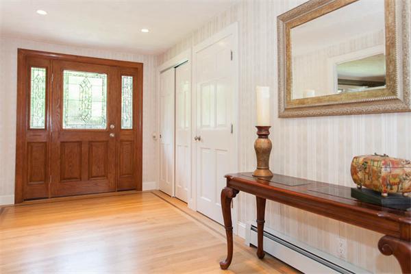 39 Circle Road Lexington, MA 02420 - Photo 2 of 24 a living room with a bed and a window