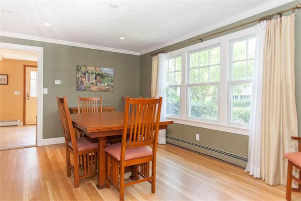 39 Circle Road Lexington, MA 02420 - Photo 3 of 24 a view of a dining room with furniture a chandelier and wooden floor