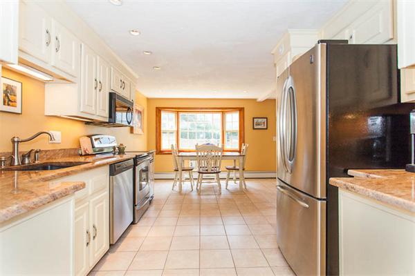 39 Circle Road Lexington, MA 02420 - Photo 6 of 24 a kitchen with stainless steel appliances granite countertop a refrigerator and a stove top oven