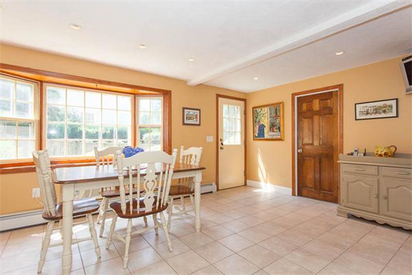 39 Circle Road Lexington, MA 02420 - Photo 8 of 24 a dining room with furniture and large windows