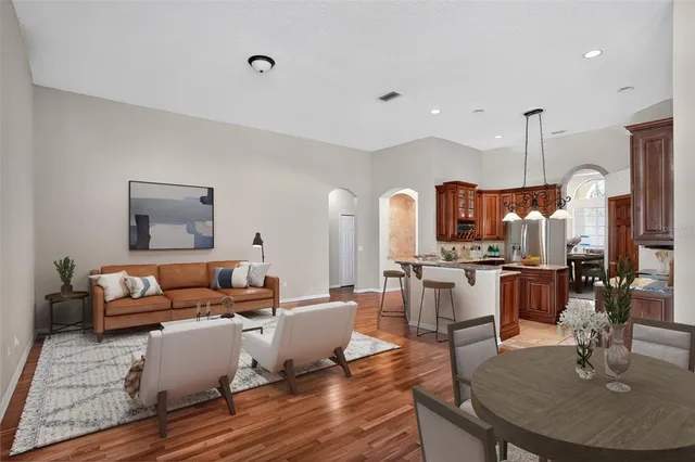a bathroom with a granite countertop sink a mirror and shower