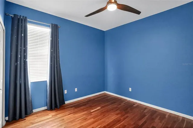 an aerial view of a house with a yard and garden