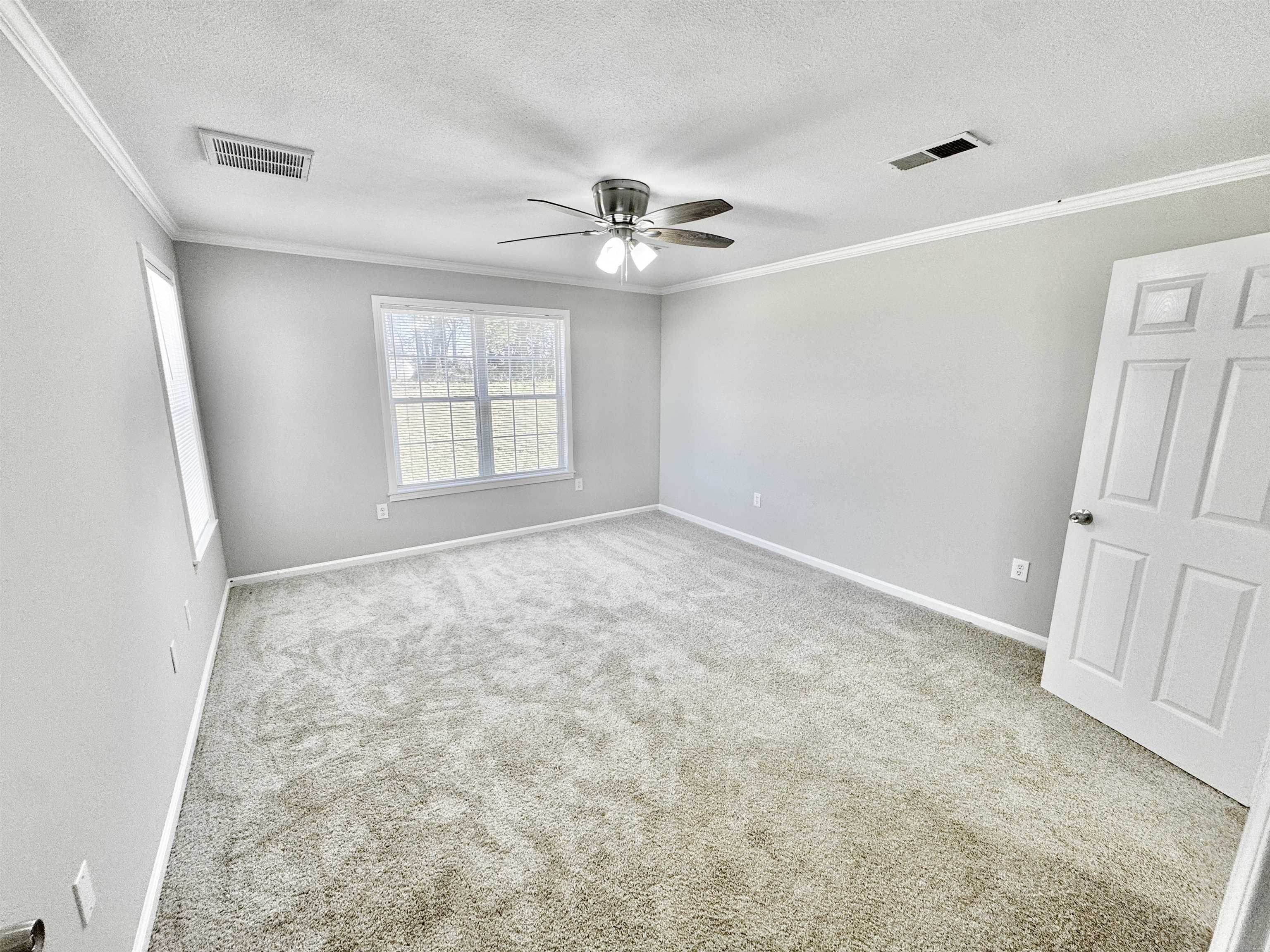 788 Bruce Road Whiteville, TN 38075 - Photo 13 of 39 Bedroom featuring light carpet, crown molding, a textured ceiling, and a ceiling fan
