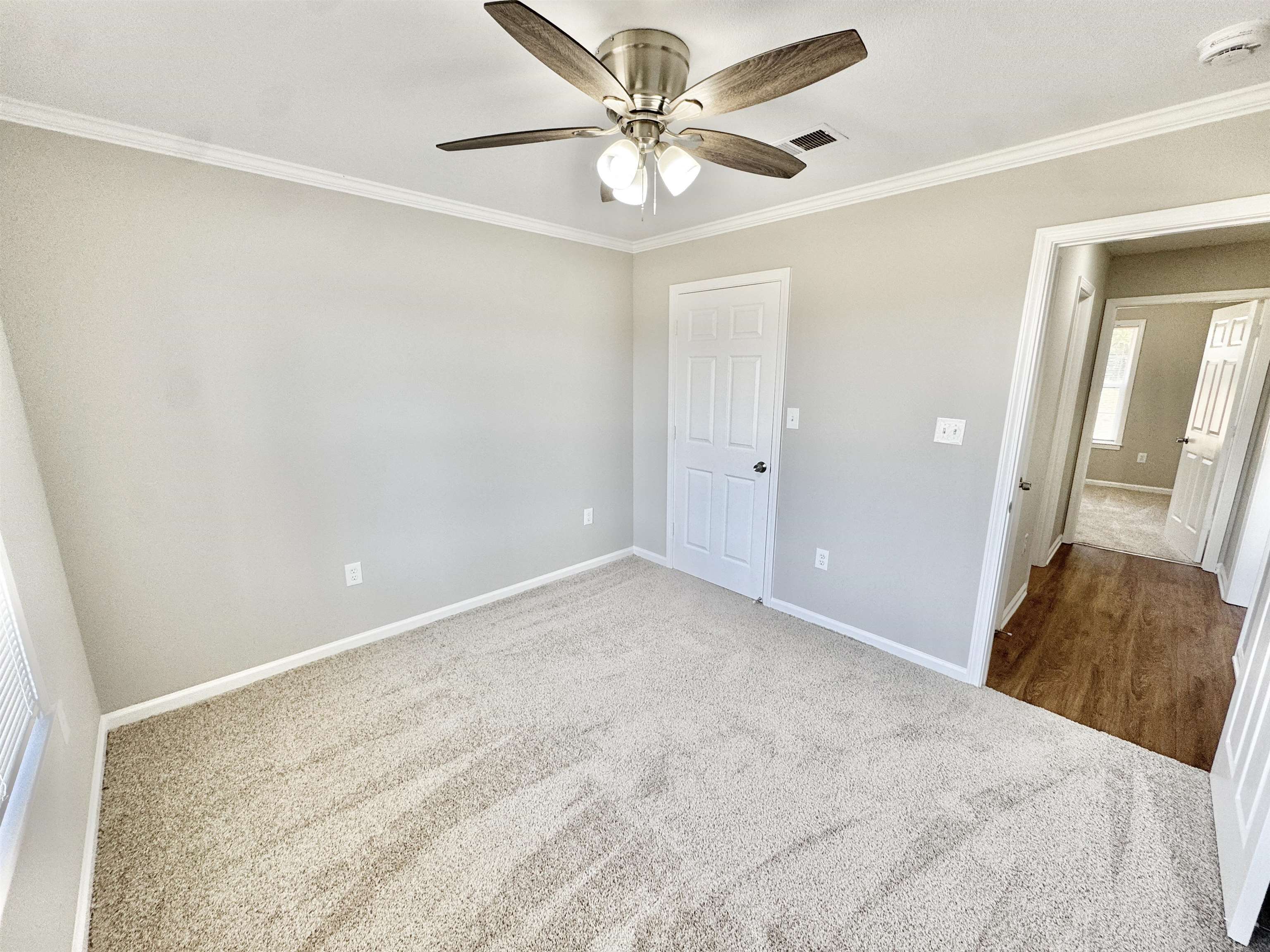 788 Bruce Road Whiteville, TN 38075 - Photo 16 of 39 Unfurnished bedroom featuring carpet flooring, ornamental molding, and a ceiling fan