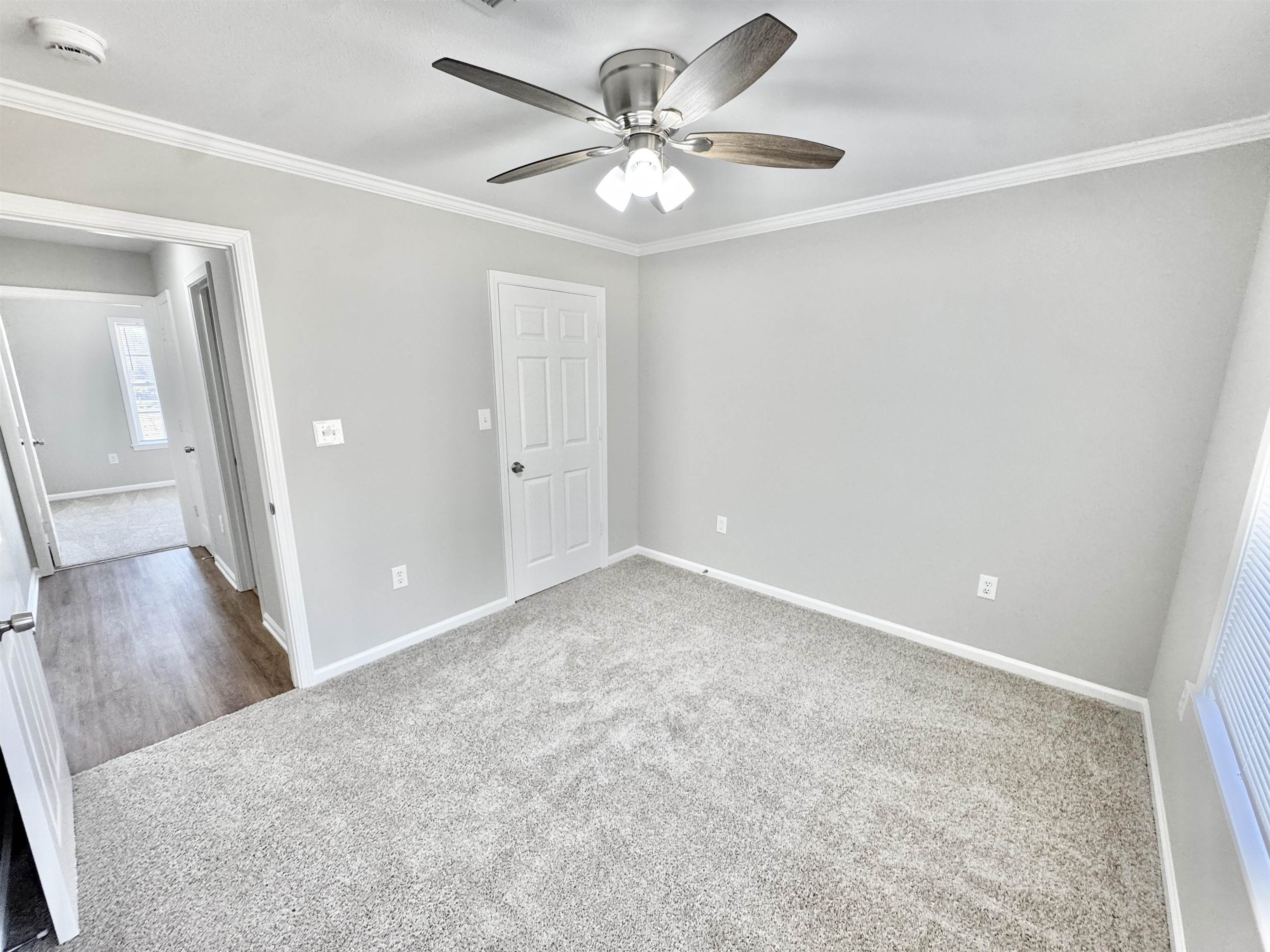 788 Bruce Road Whiteville, TN 38075 - Photo 21 of 39 Unfurnished bedroom featuring carpet floors, ornamental molding, and ceiling fan