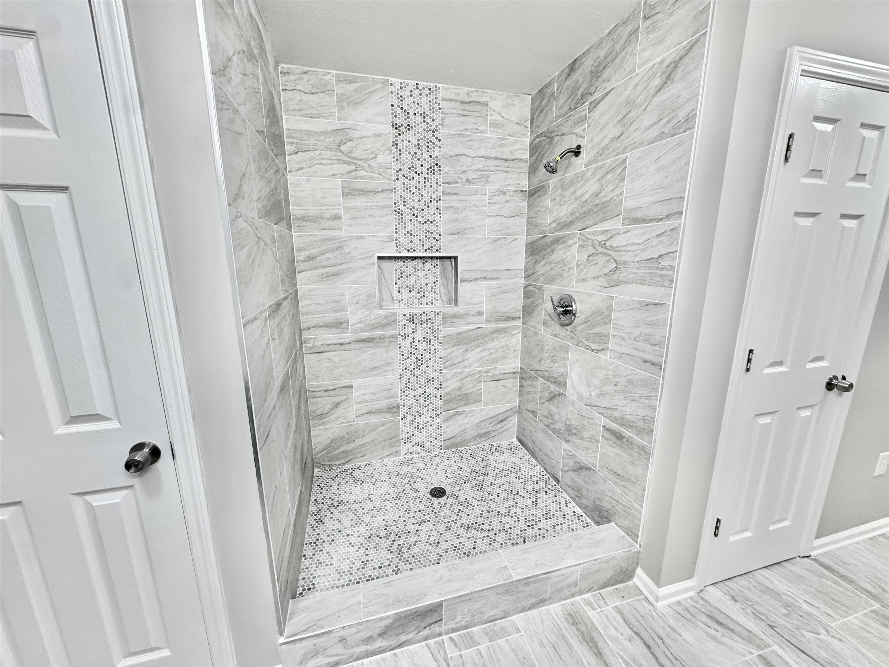788 Bruce Road Whiteville, TN 38075 - Photo 23 of 39 Bathroom featuring a stall shower and baseboards
