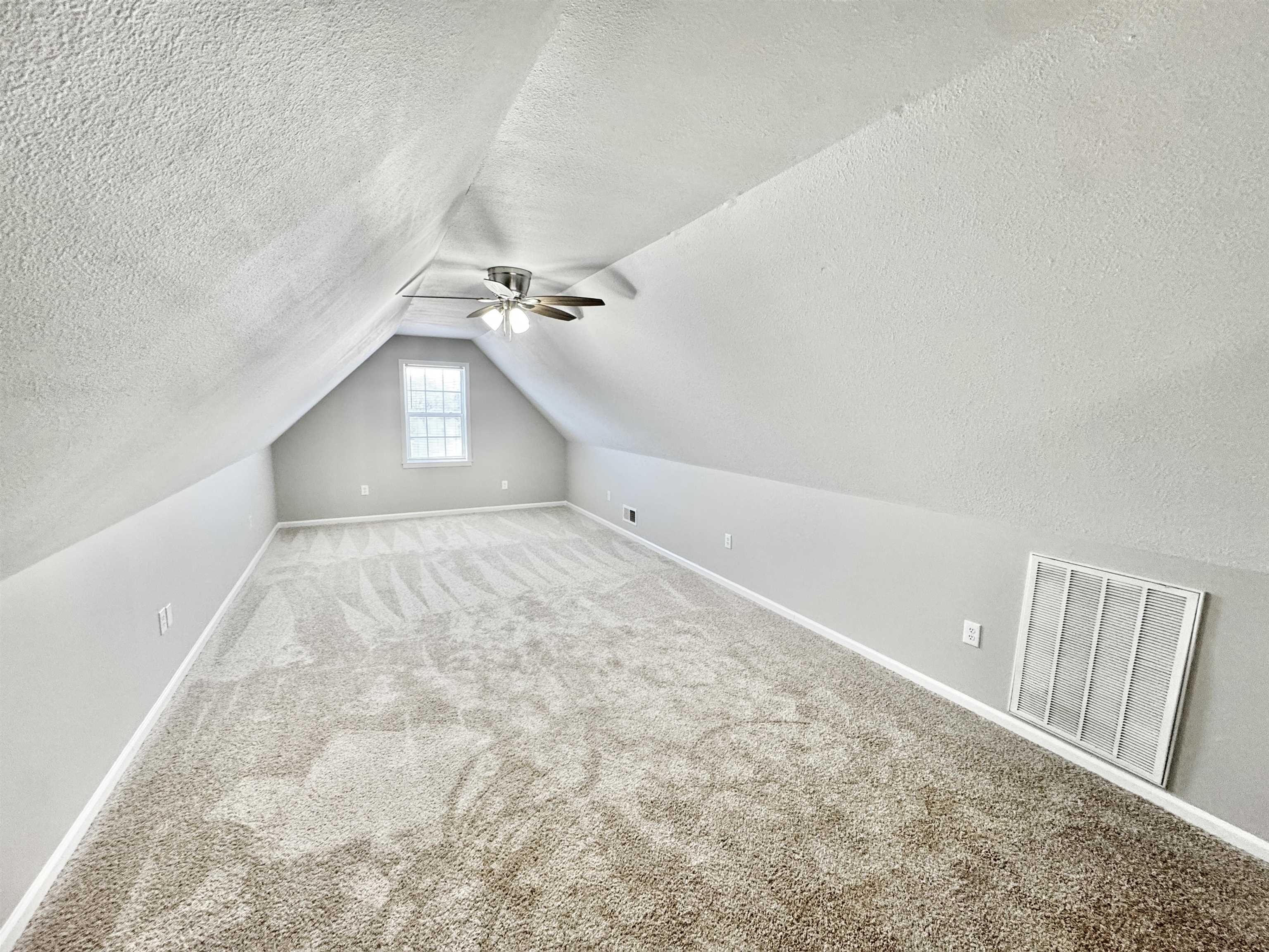 788 Bruce Road Whiteville, TN 38075 - Photo 24 of 39 Upstairs bedroom with carpet flooring, vaulted ceiling, and a ceiling fan