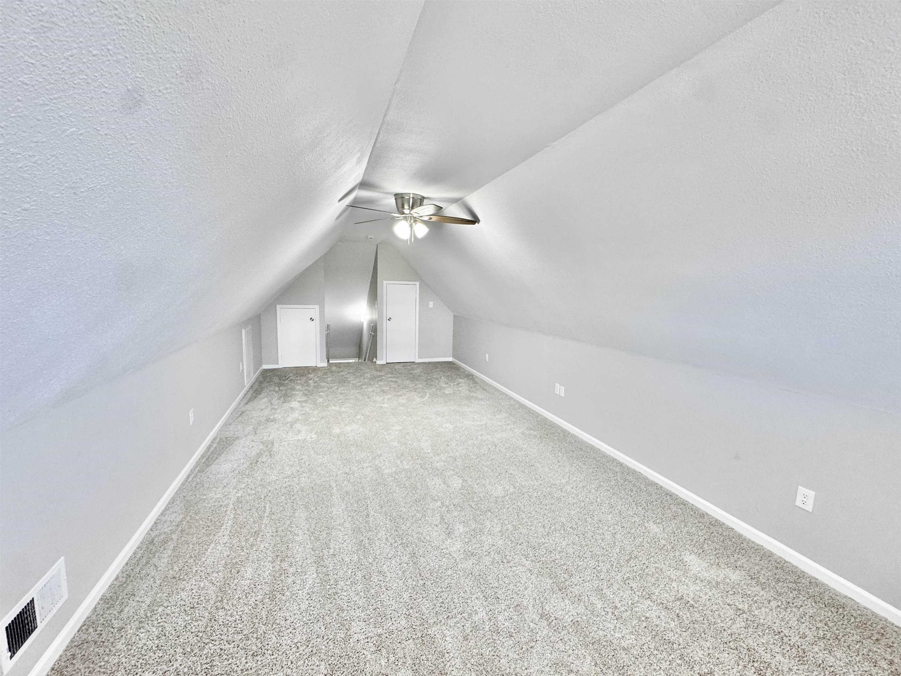 788 Bruce Road Whiteville, TN 38075 - Photo 25 of 39 Upstairs Bedroom with carpet floors, a ceiling fan, and vaulted ceiling