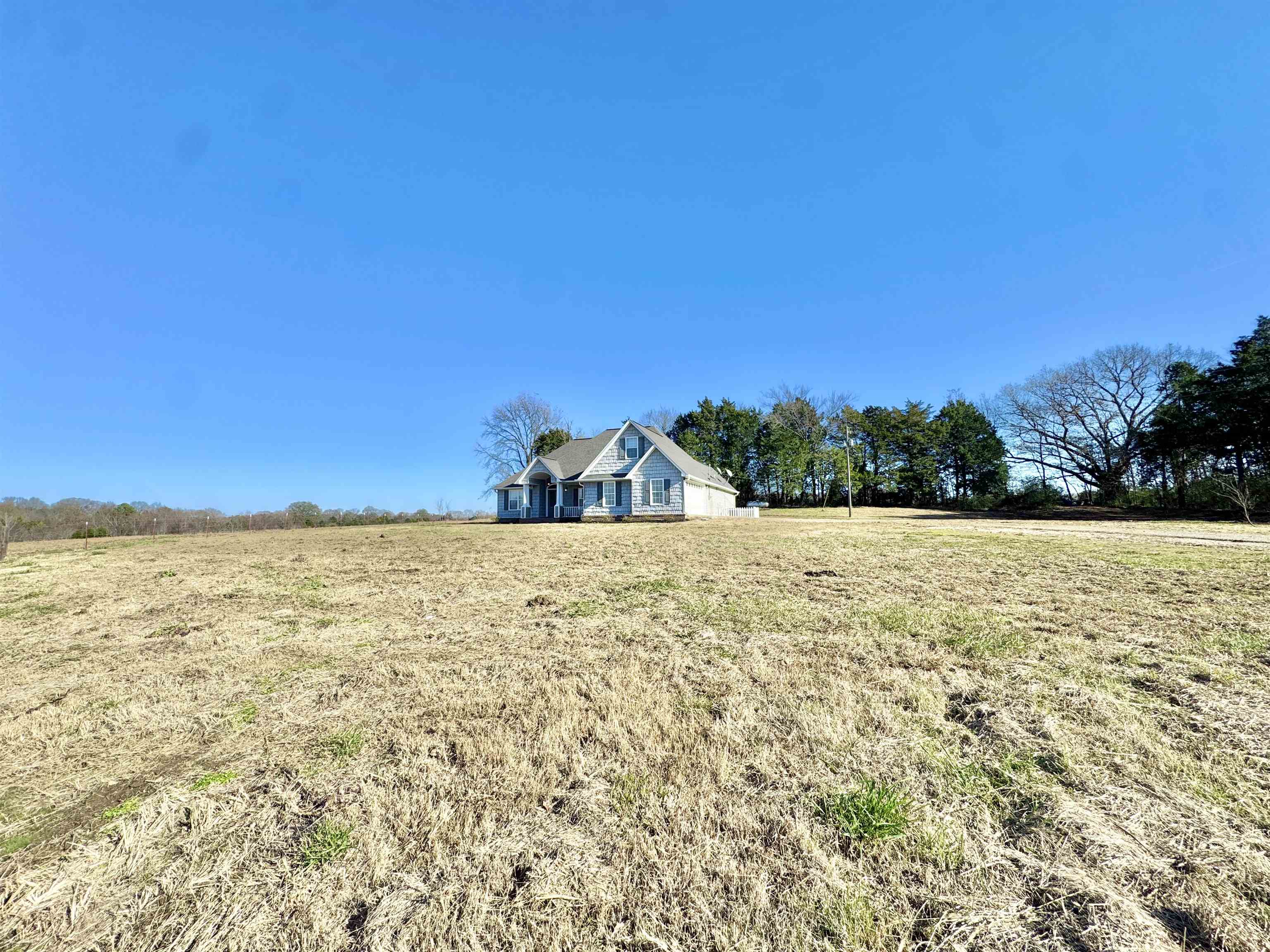 788 Bruce Road Whiteville, TN 38075 - Photo 29 of 39 View of green lawn featuring a view of rural / pastoral area