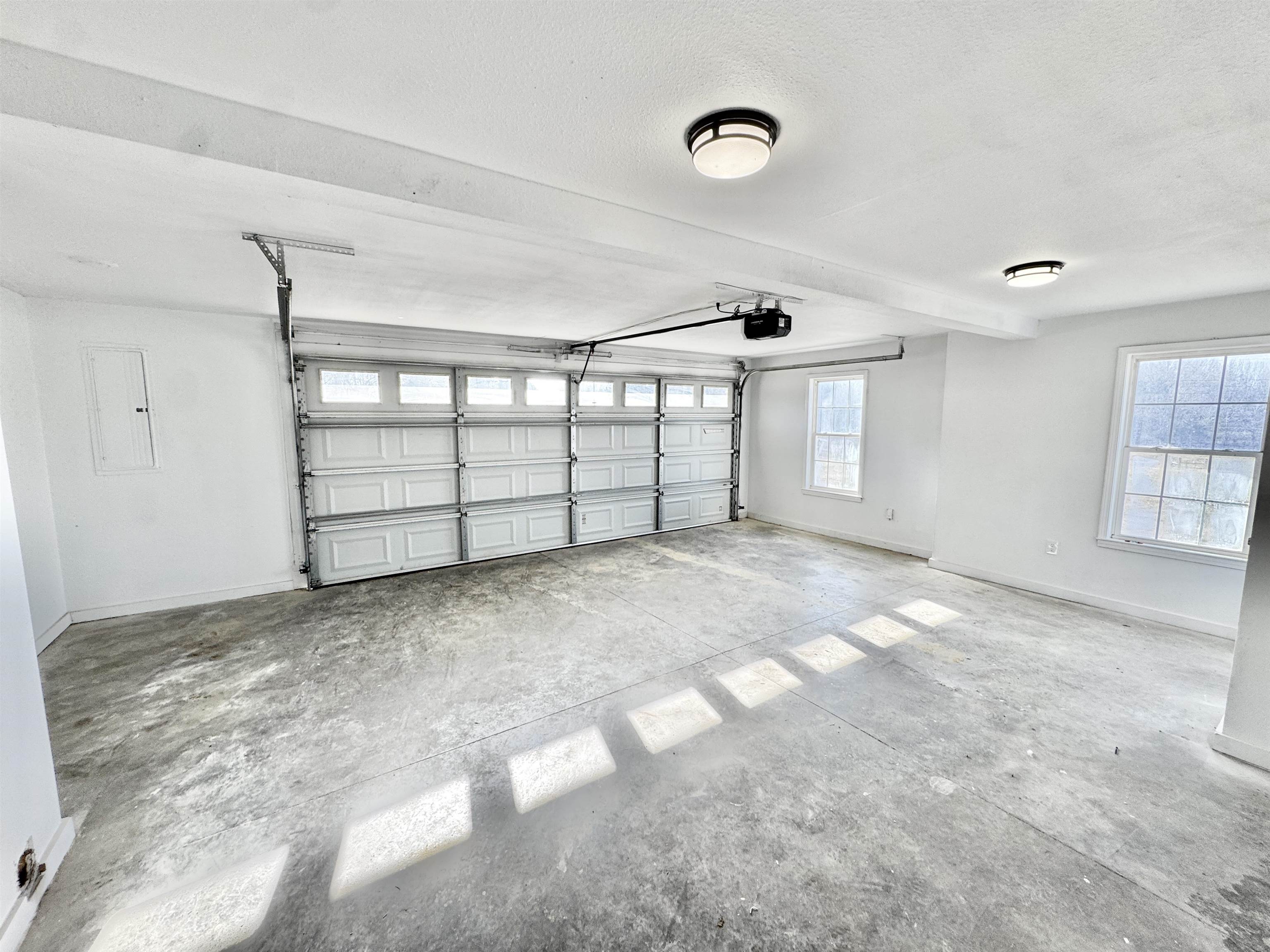 788 Bruce Road Whiteville, TN 38075 - Photo 35 of 39 Garage featuring baseboards and electric panel