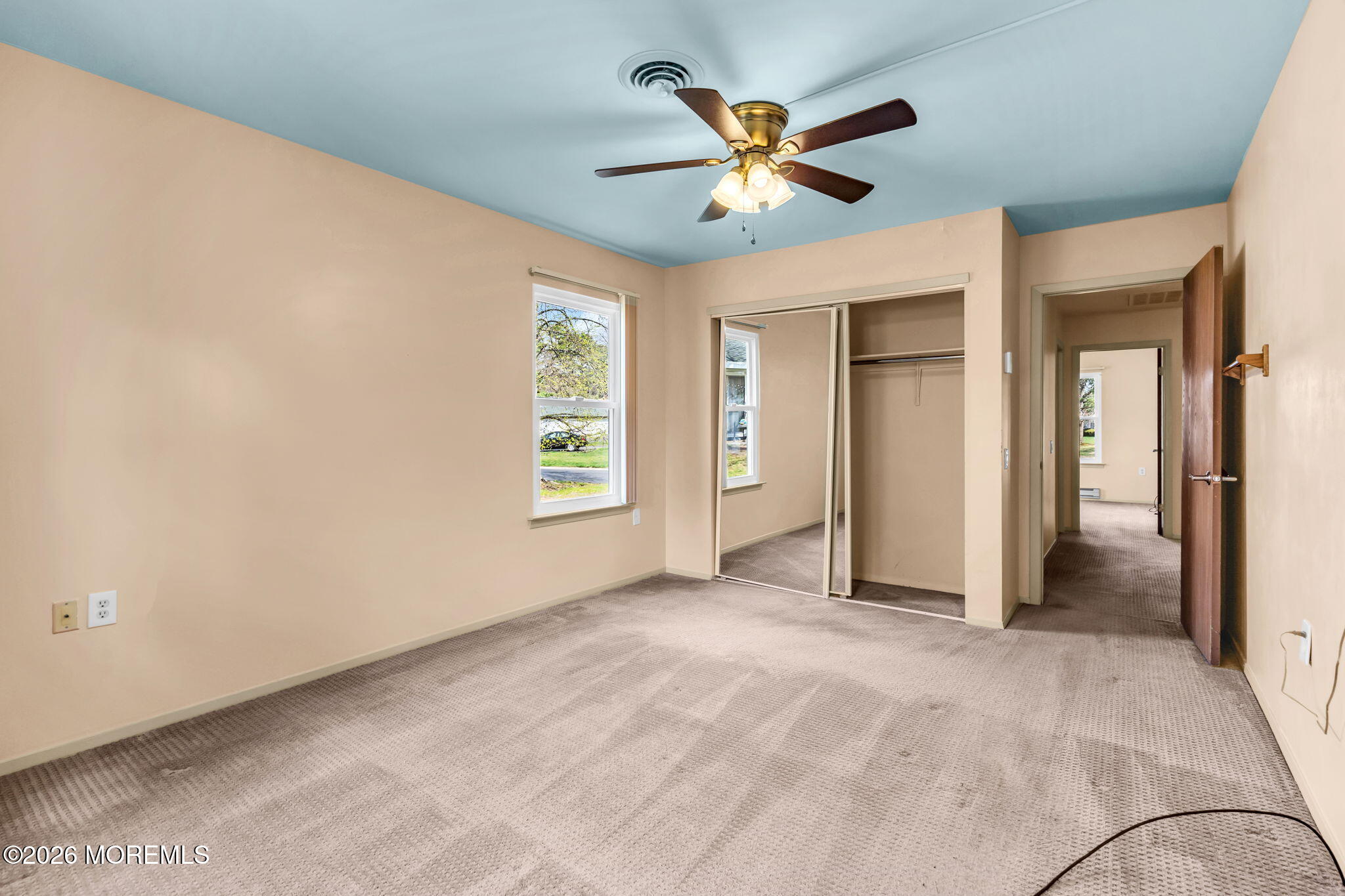 20B Amesbury Road, Unit B Whiting, NJ 08759 - Photo 12 of 25 an empty room with windows and fan