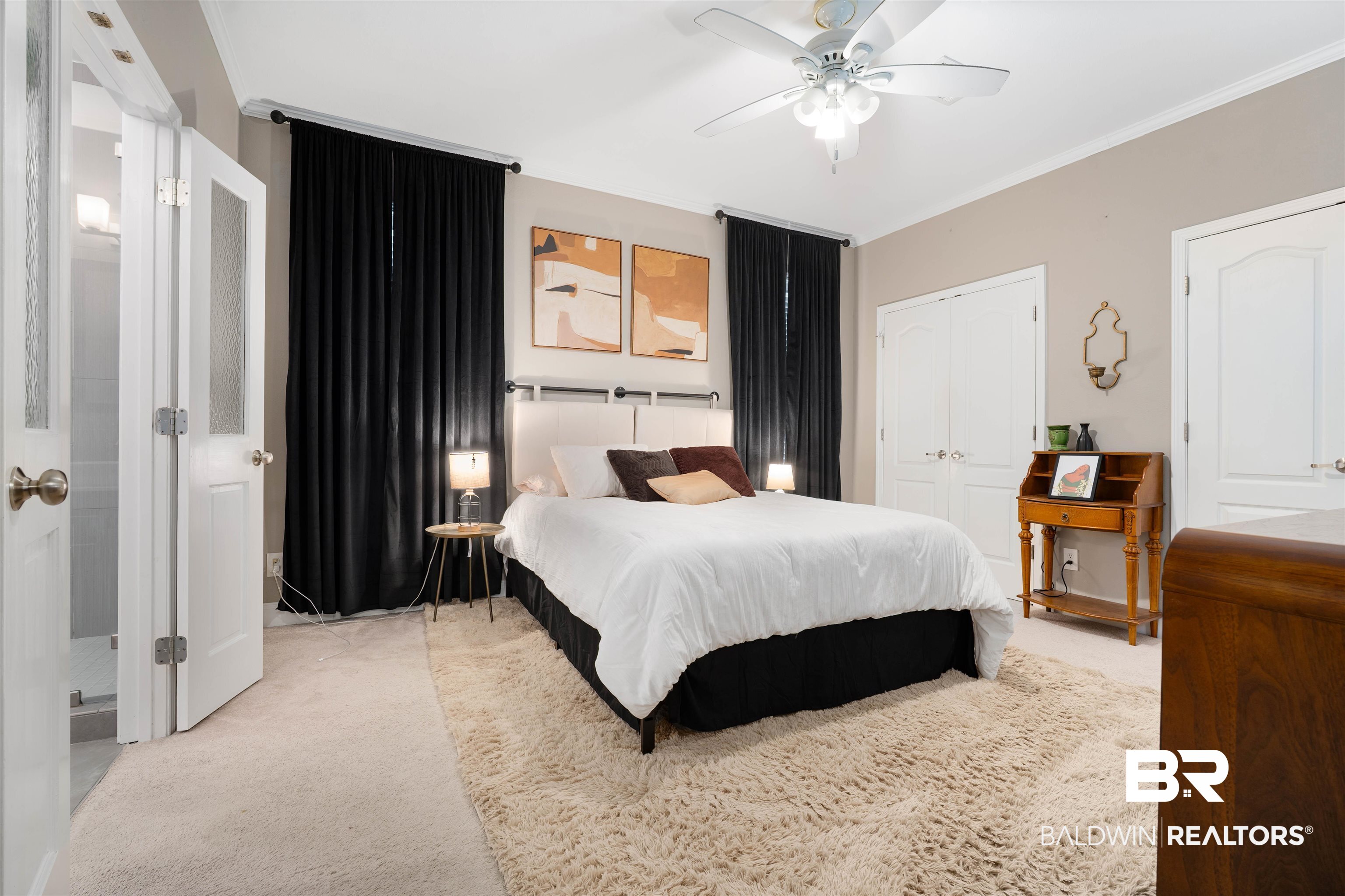 25806 Pollard Road, Unit 205 Daphne, AL 36526 - Photo 11 of 26 Carpeted bedroom featuring crown molding, two closets, and ceiling fan