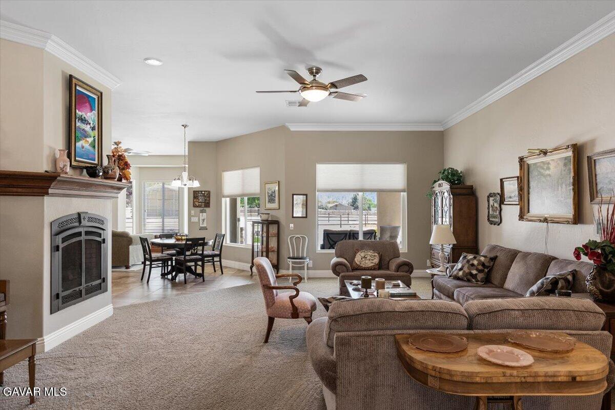 23840 Martingale Way Tehachapi, CA 93561 - Photo 10 of 63 a living room with fireplace furniture and a large window