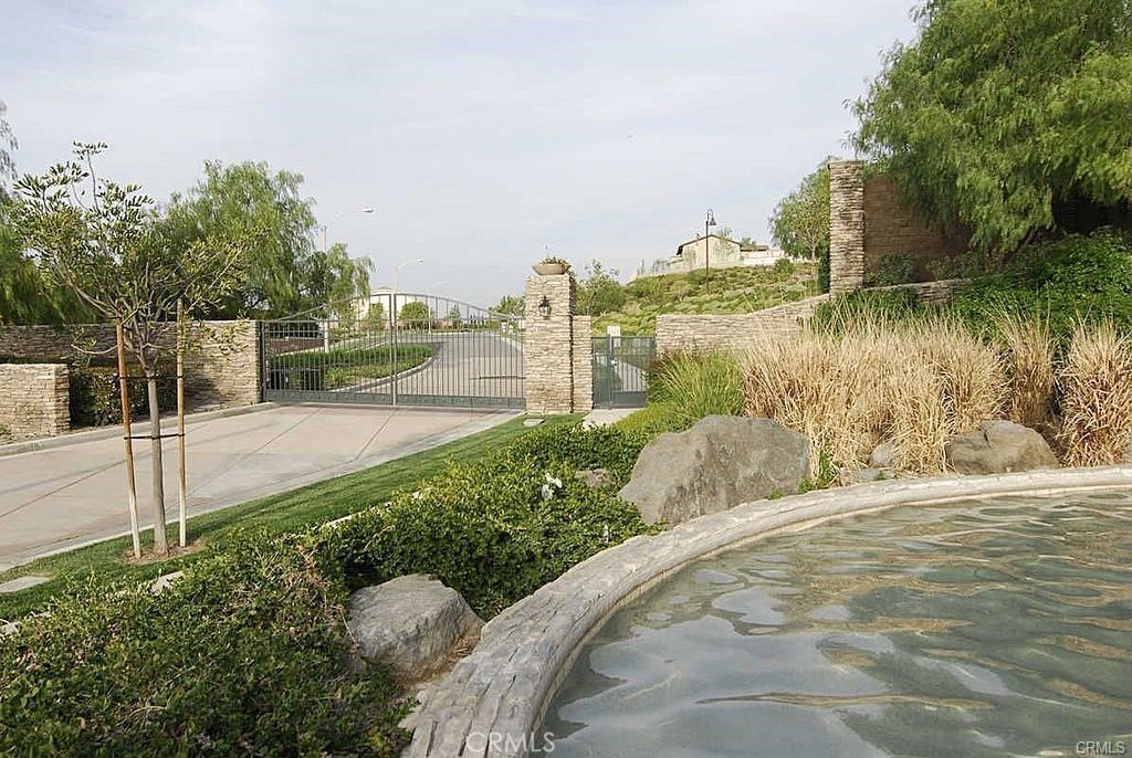 10926 Playa Del Sol Riverside, CA 92503 - Photo 4 of 18 Community Front Gate