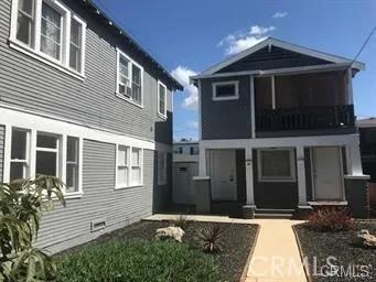 a view of house with yard