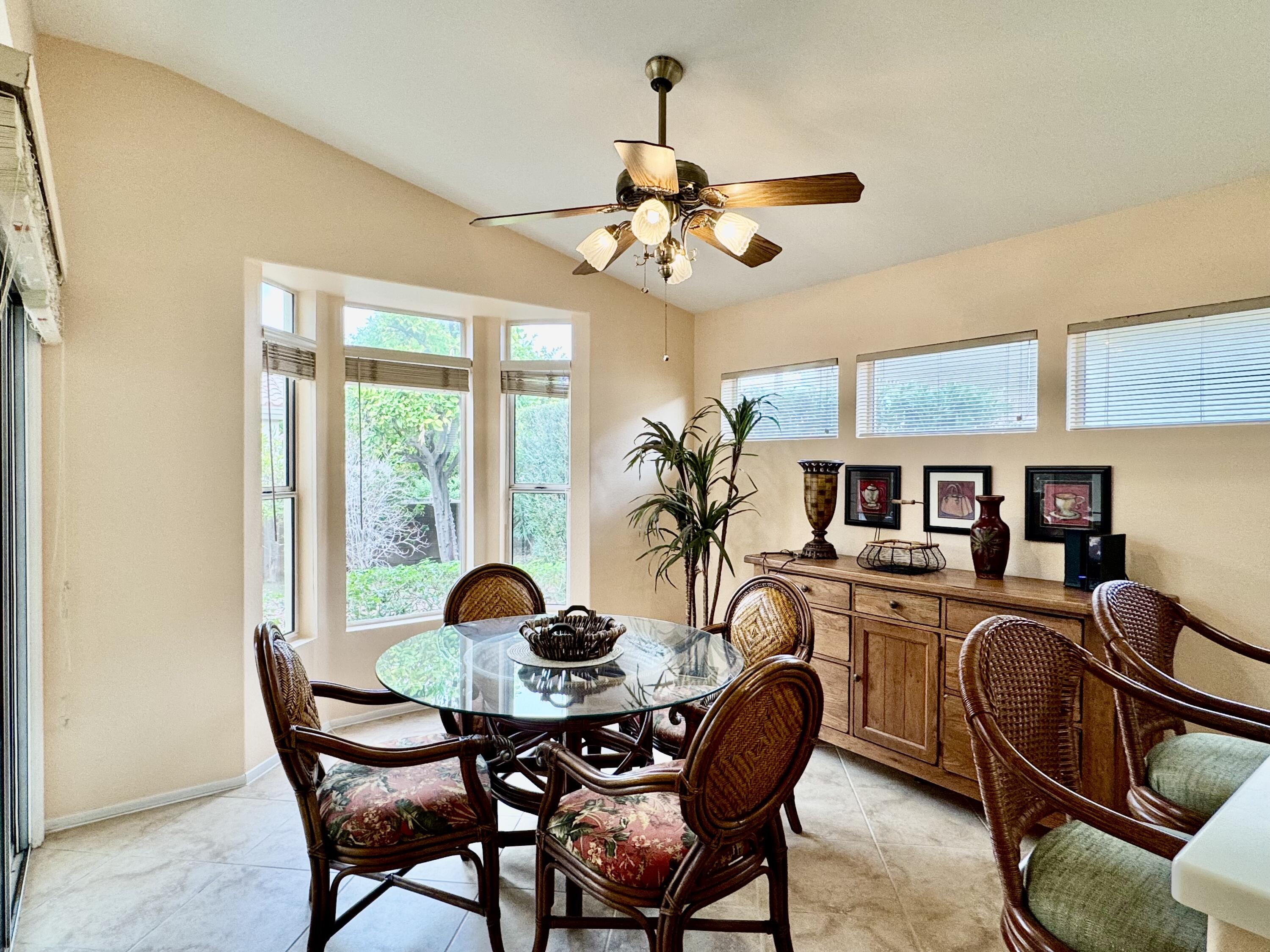 78376 Moongold Road Palm Desert, CA 92211 - Photo 3 of 36 a view of a dining room with furniture window and outside view