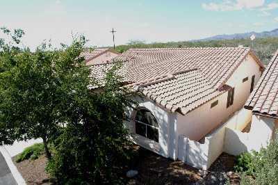 3390 West Desert Bend Loop Tucson, AZ 85742 - Photo 3 of 4 a front view of a house with a yard