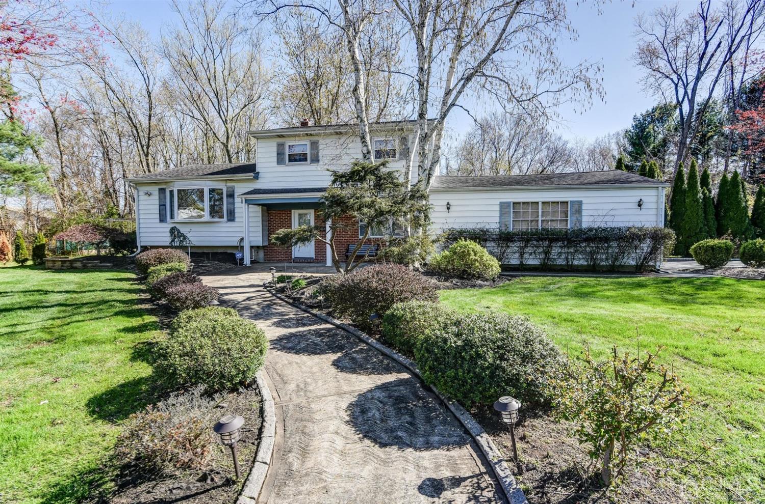 8 Innes Road East Brunswick, NJ 08816 - Photo 2 of 32 a front view of a house with a yard