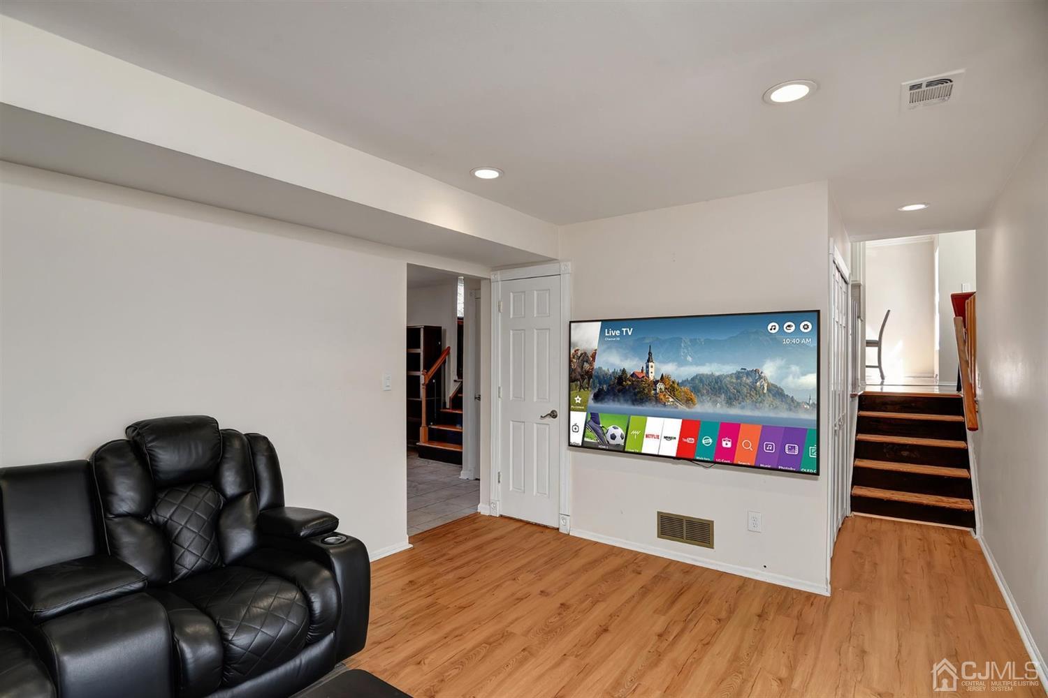 8 Innes Road East Brunswick, NJ 08816 - Photo 17 of 32 a living room with furniture and a wooden floor