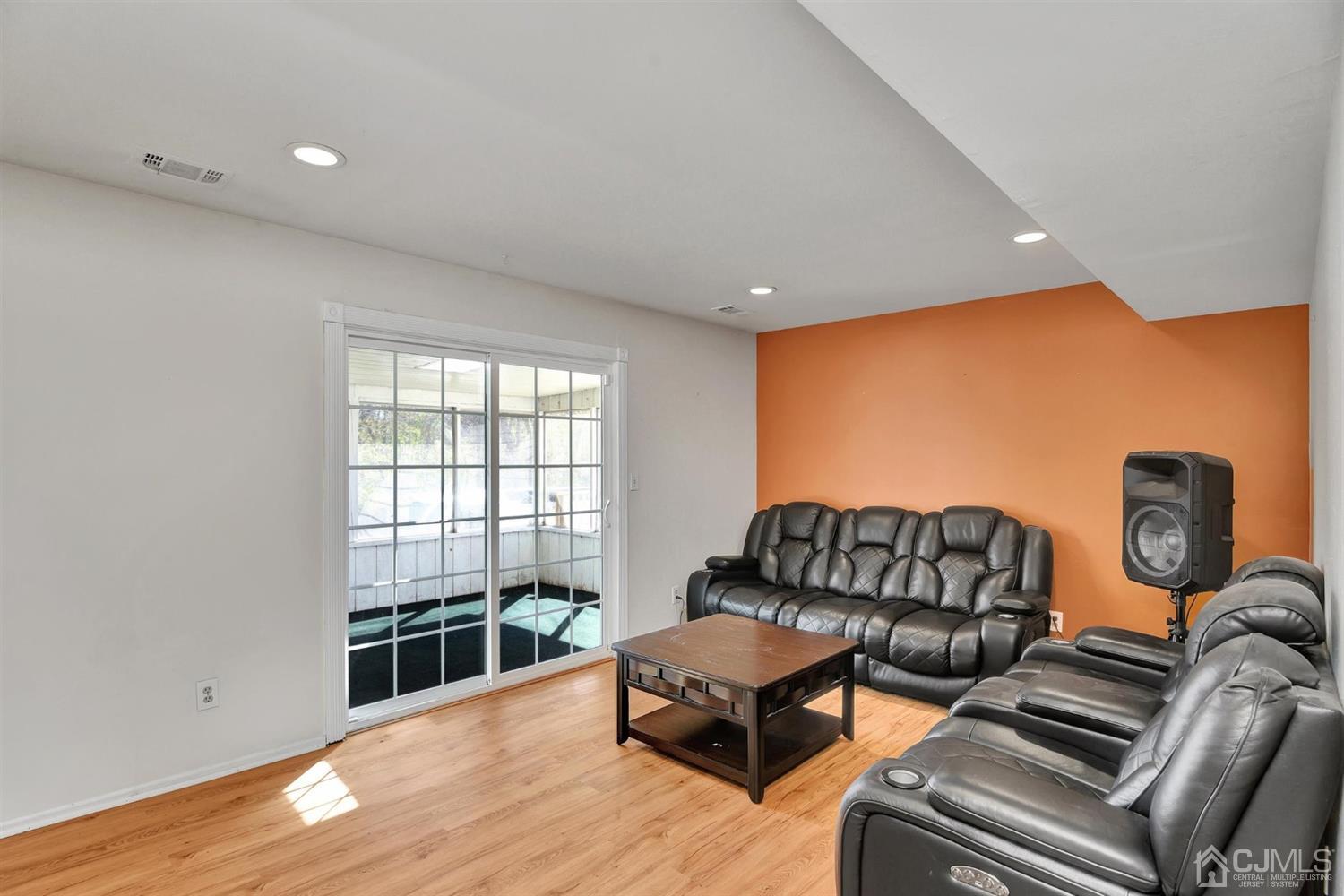 8 Innes Road East Brunswick, NJ 08816 - Photo 18 of 32 a living room with furniture a couch and wooden floor