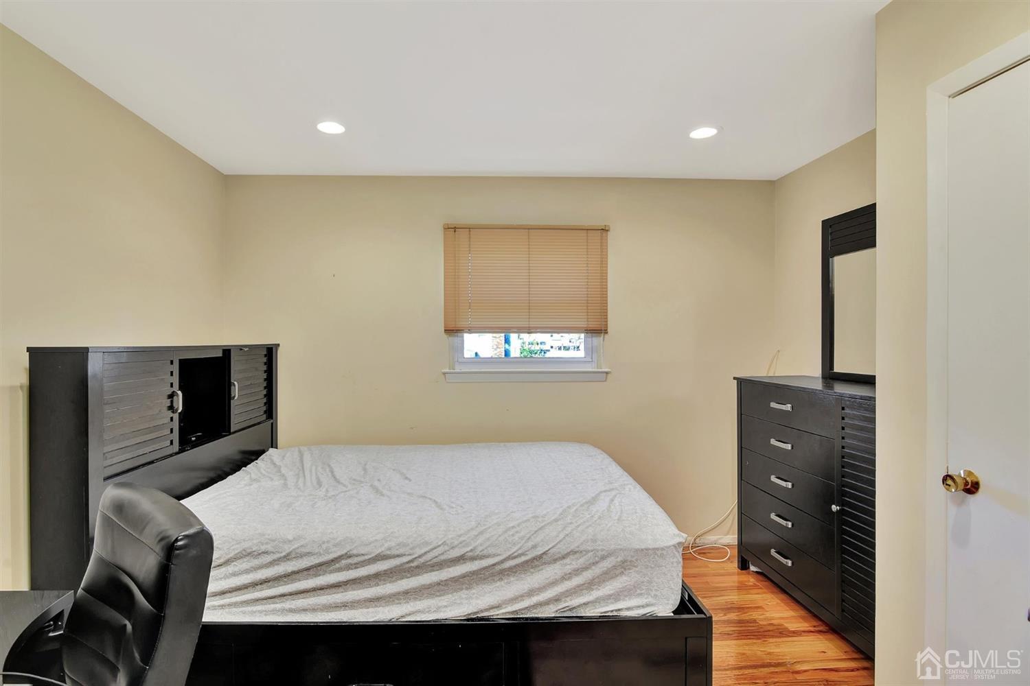 8 Innes Road East Brunswick, NJ 08816 - Photo 21 of 32 a bedroom with a bed and a dresser