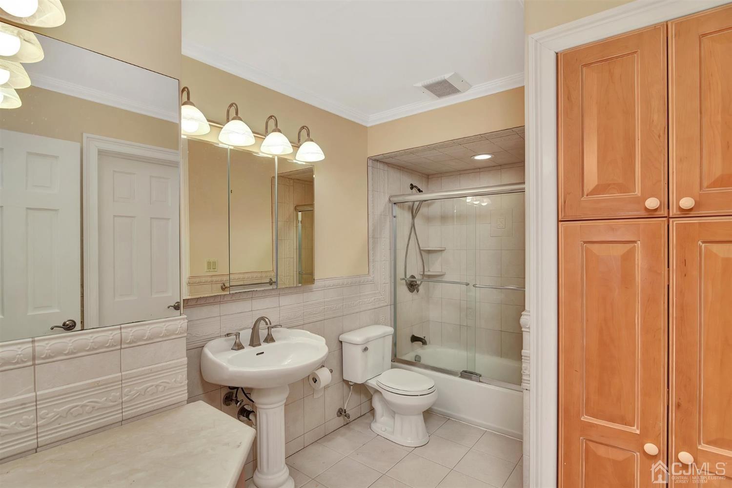 8 Innes Road East Brunswick, NJ 08816 - Photo 23 of 32 a bathroom with a sink a toilet and shower