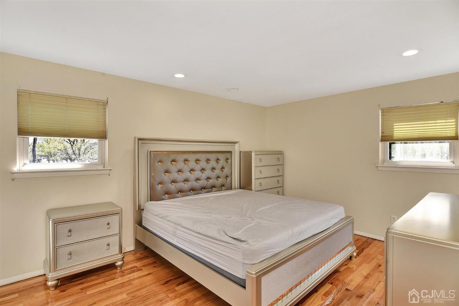 8 Innes Road East Brunswick, NJ 08816 - Photo 24 of 32 a bedroom with a bed and a night stand