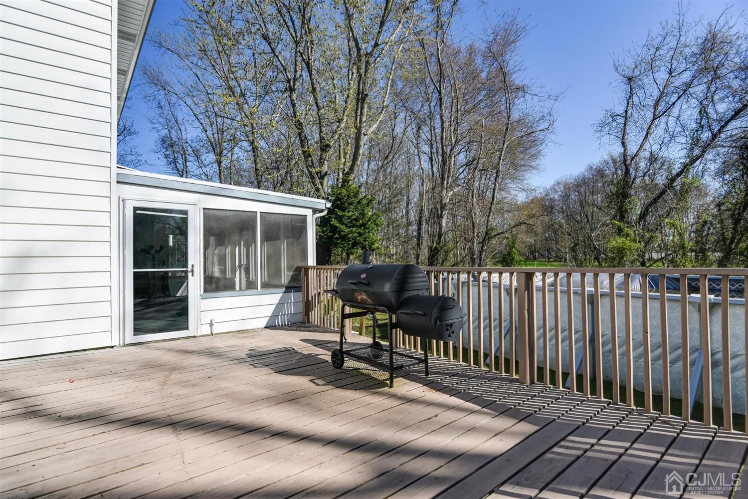 8 Innes Road East Brunswick, NJ 08816 - Photo 27 of 32 a view of a chair and tables in the back yard of the house