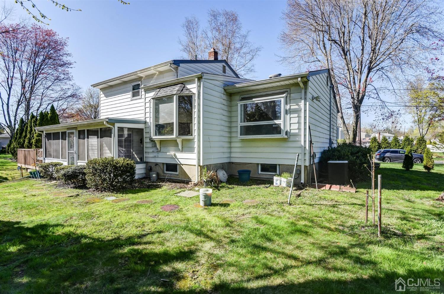 8 Innes Road East Brunswick, NJ 08816 - Photo 31 of 32 a front view of a house with a yard