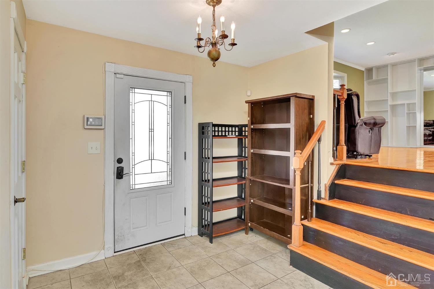 8 Innes Road East Brunswick, NJ 08816 - Photo 5 of 32 a view of a livingroom with a staircase