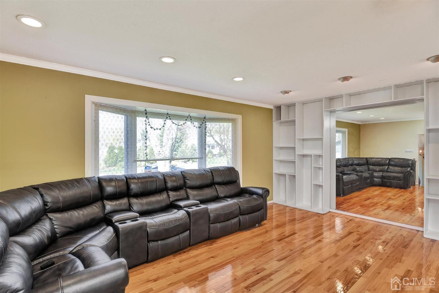 8 Innes Road East Brunswick, NJ 08816 - Photo 6 of 32 a living room with furniture and a large window