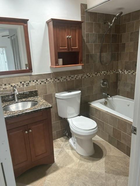 13716 Southwest 149th Cir Lane, Unit 461 Miami, FL 33186 - Photo 7 of 9 a bathroom with a sink toilet and shower