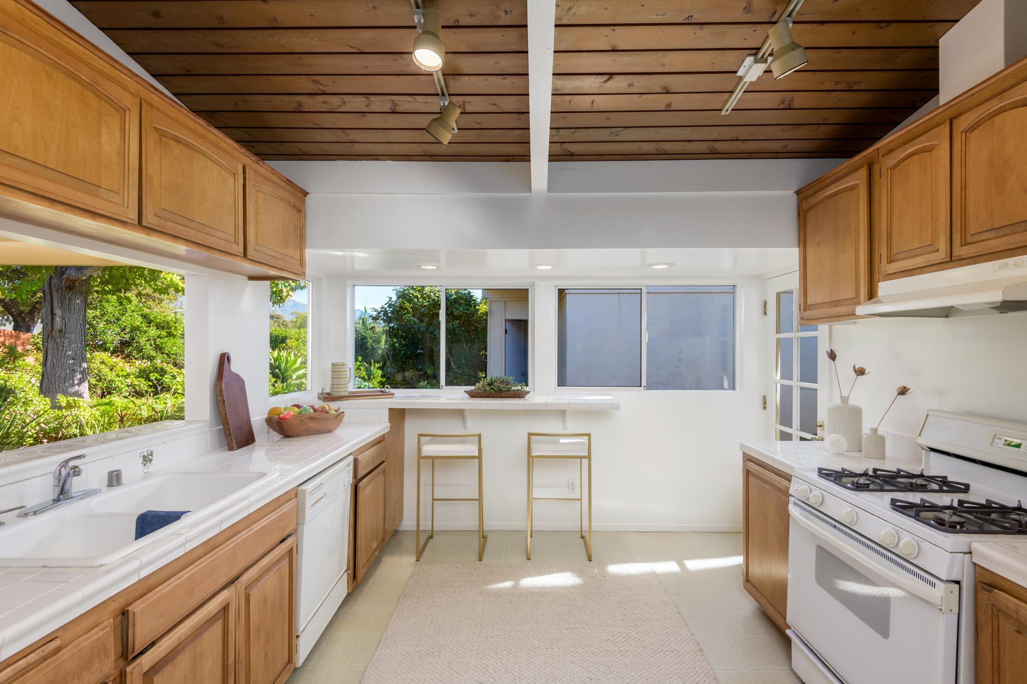 4840 Winding Way Santa Barbara, CA 93111 - Photo 11 of 22 a kitchen with stainless steel appliances granite countertop a stove a sink and a microwave