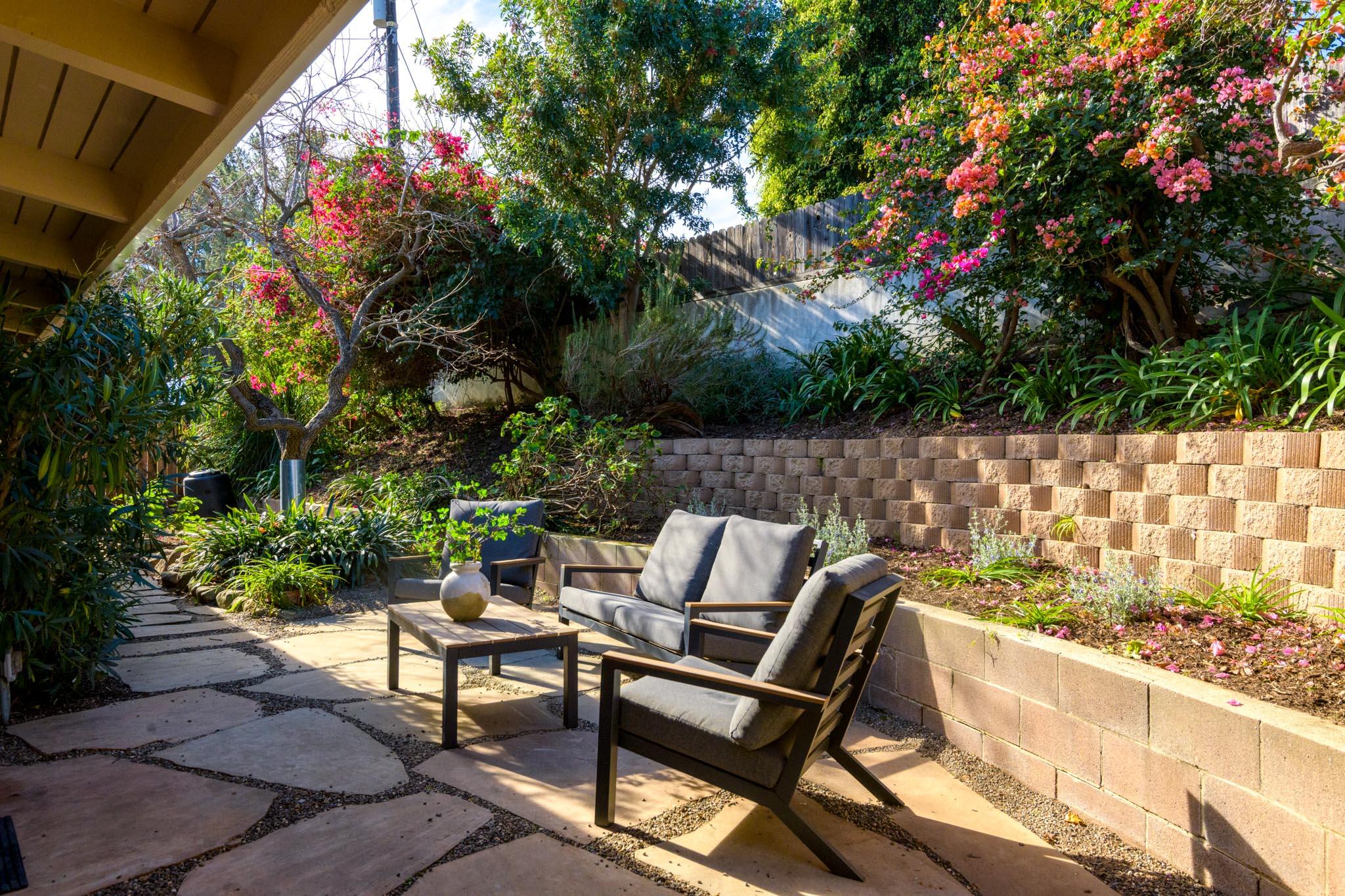 4840 Winding Way Santa Barbara, CA 93111 - Photo 18 of 22 a roof deck with table and chairs and potted plants