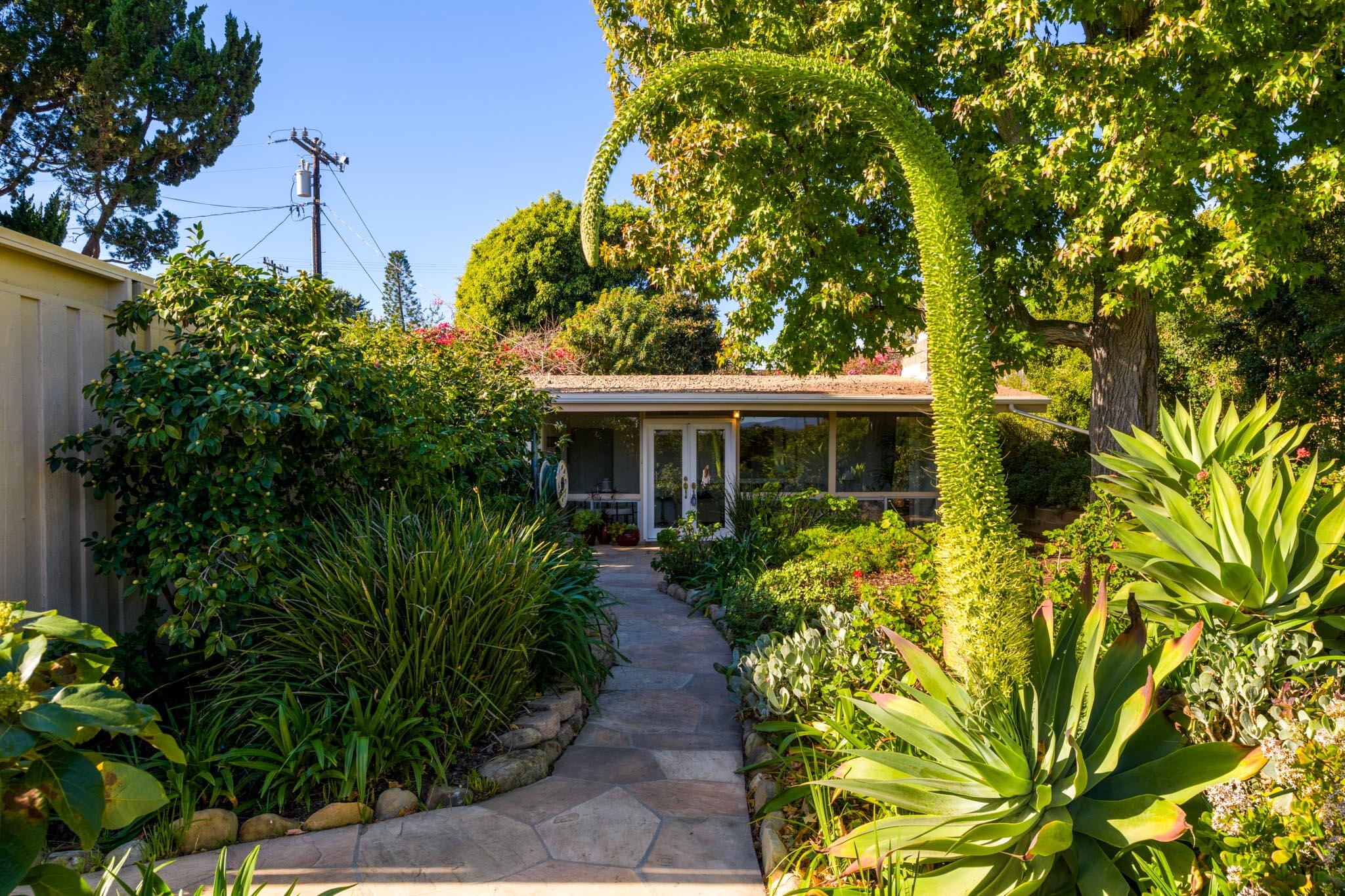 4840 Winding Way Santa Barbara, CA 93111 - Photo 3 of 22 a front view of a house with garden