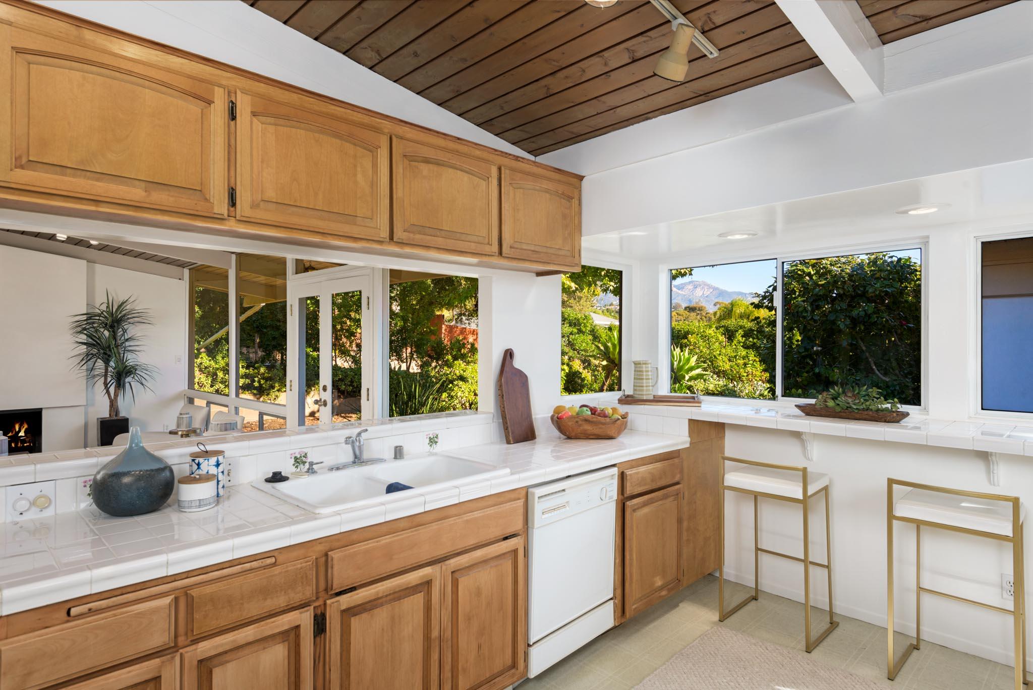 4840 Winding Way Santa Barbara, CA 93111 - Photo 10 of 22 a kitchen with sink a window and cabinets