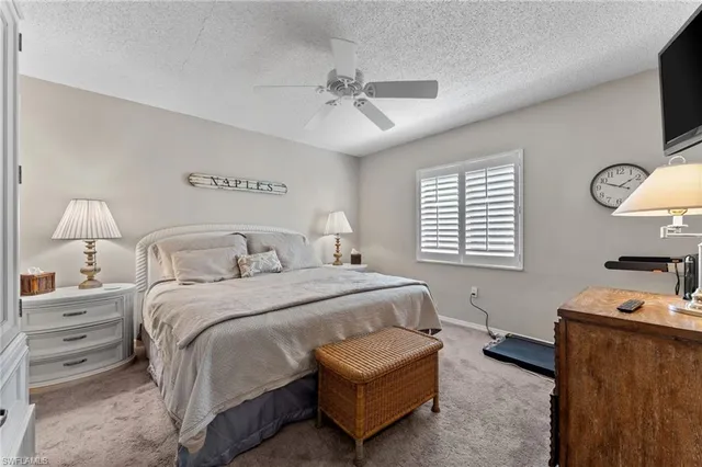 a bedroom with bed and window