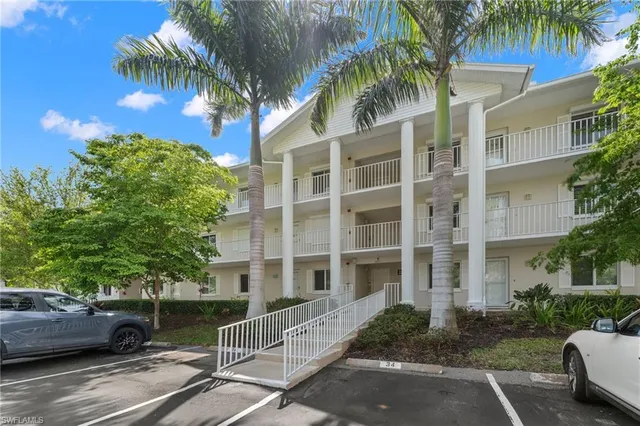a view of a street with a building in the background
