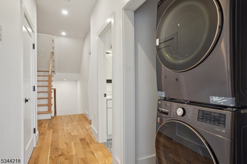 51 New Street, Unit B Montclair, NJ 07042 - Photo 20 of 32 a view of a hallway with washer and dryer