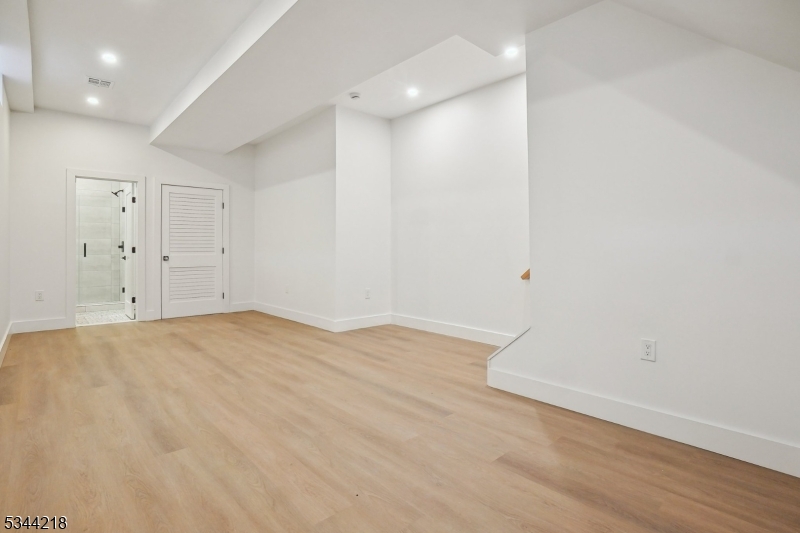51 New Street, Unit B Montclair, NJ 07042 - Photo 23 of 32 wooden floor in an empty room