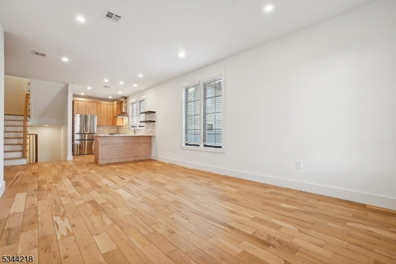 51 New Street, Unit B Montclair, NJ 07042 - Photo 3 of 32 a view of an empty room with a kitchen