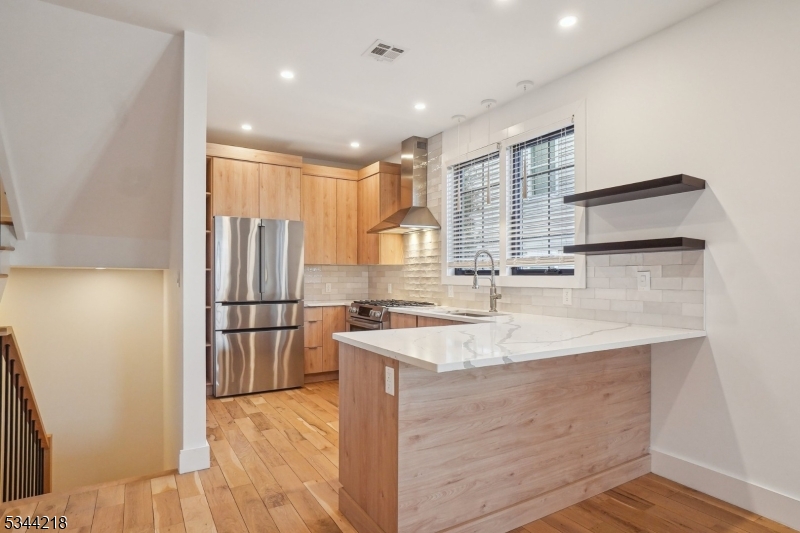 51 New Street, Unit B Montclair, NJ 07042 - Photo 5 of 32 a kitchen with a sink appliances and cabinets
