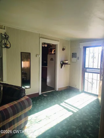 a view of a livingroom with a staircase