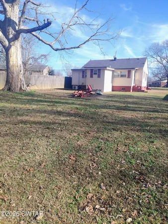 a view of a yard in front of a house