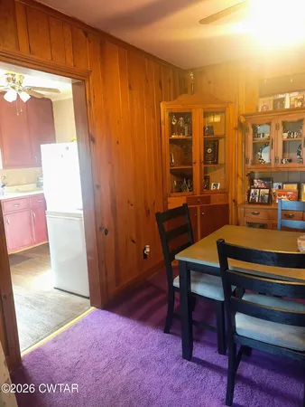 a view of a livingroom with furniture and window
